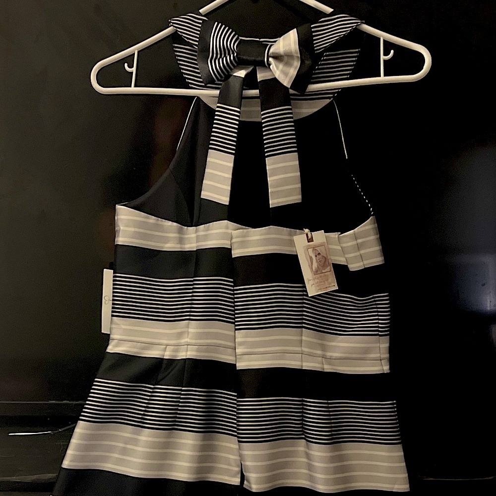 Black and white striped cocktail dress with bow in the back. “Jesica Simpson”